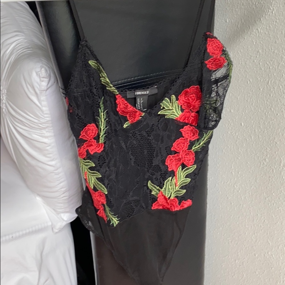 Selling lace embroidered bodysuit